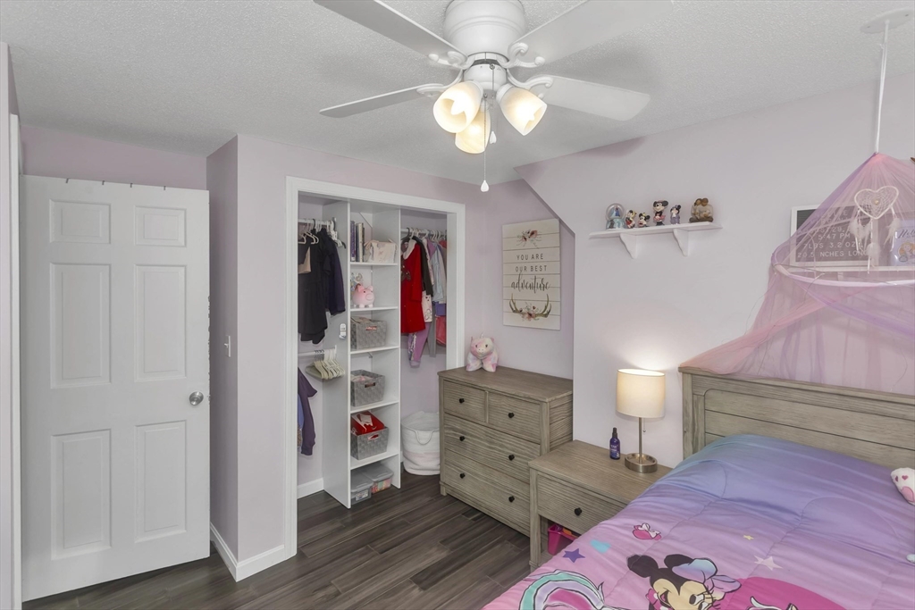 21 Brentwood Street Springfield, MA 01108 - Photo 24 of 41 a view of a bedroom with bed and workspace