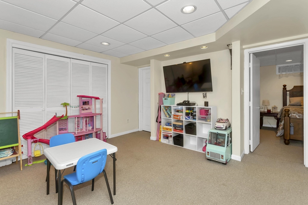 21 Brentwood Street Springfield, MA 01108 - Photo 30 of 41 a room with furniture and a flat screen tv