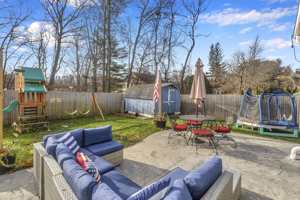 21 Brentwood Street Springfield, MA 01108 - Photo 33 of 41 a backyard of a house with table and chairs