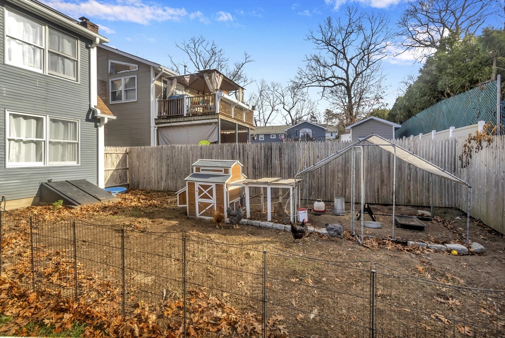 21 Brentwood Street Springfield, MA 01108 - Photo 36 of 41 a view of a house with backyard and sitting area