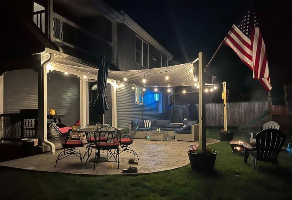 21 Brentwood Street Springfield, MA 01108 - Photo 40 of 41 a patio with a table and chairs