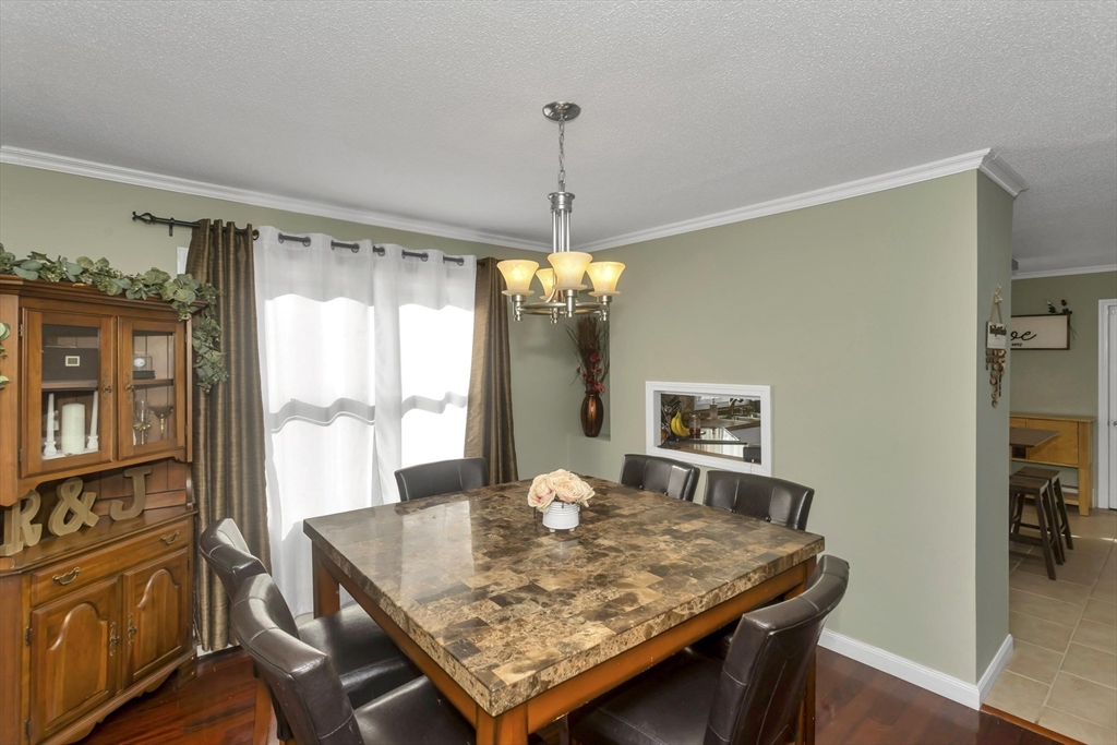 21 Brentwood Street Springfield, MA 01108 - Photo 10 of 41 a view of a dining room with furniture window and wooden floor