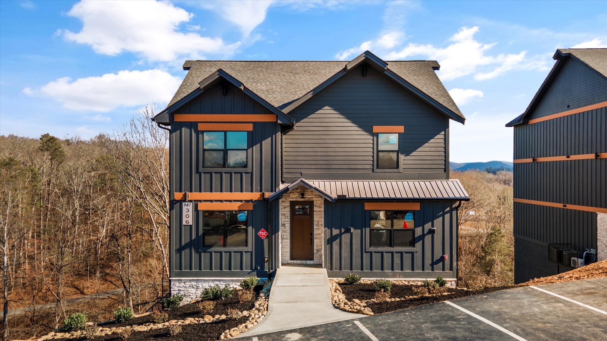 332 Rambling Creek Way Sevierville, TN 37862 - Photo 2 of 54 a front view of a house with glass door