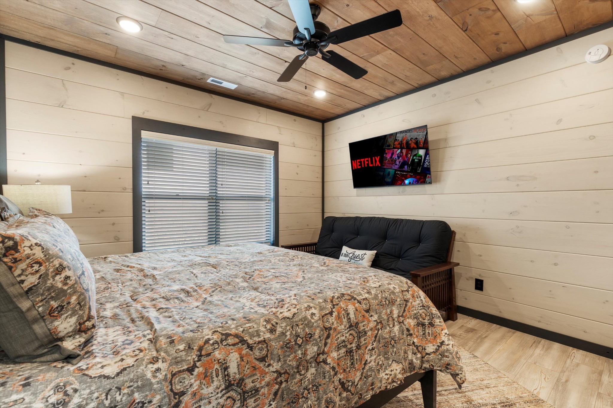 332 Rambling Creek Way Sevierville, TN 37862 - Photo 34 of 54 a bedroom with a bed and a flat screen tv