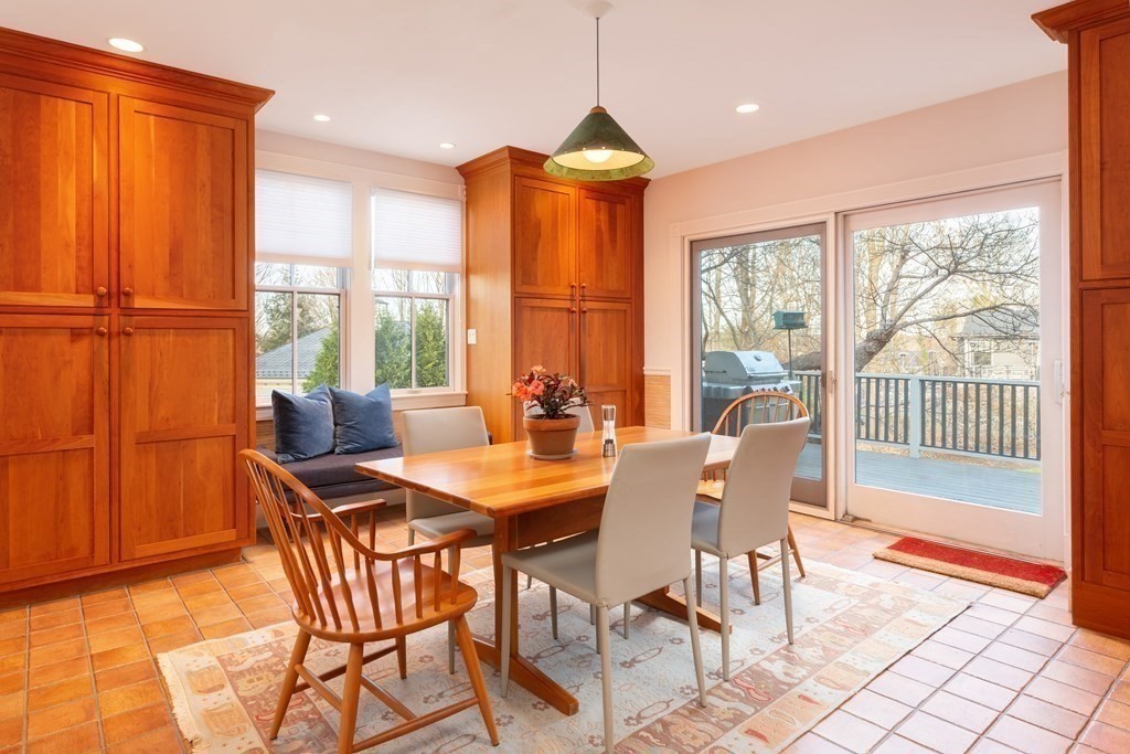 44 Putnam Street Newton, MA 02465 - Photo 11 of 24 a dining room with furniture a chandelier and wooden floor