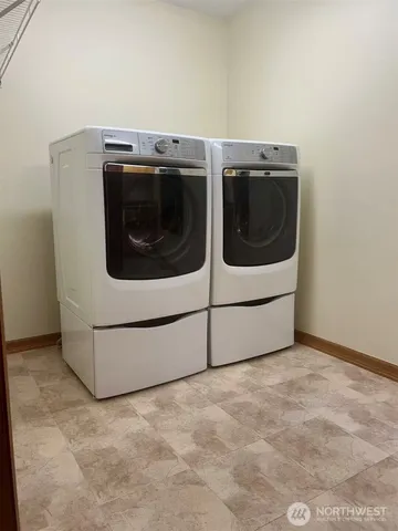 a utility room with dryer and washer
