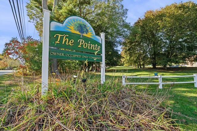 a view of a park that has a sign board