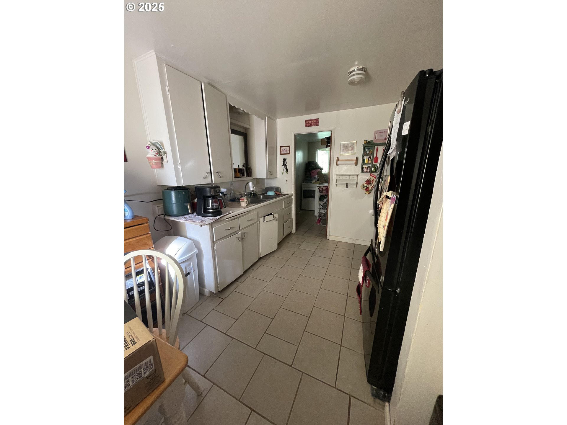 465 Davis Street Eugene, OR 97402 - Photo 11 of 11 a kitchen with a sink and a stove top oven