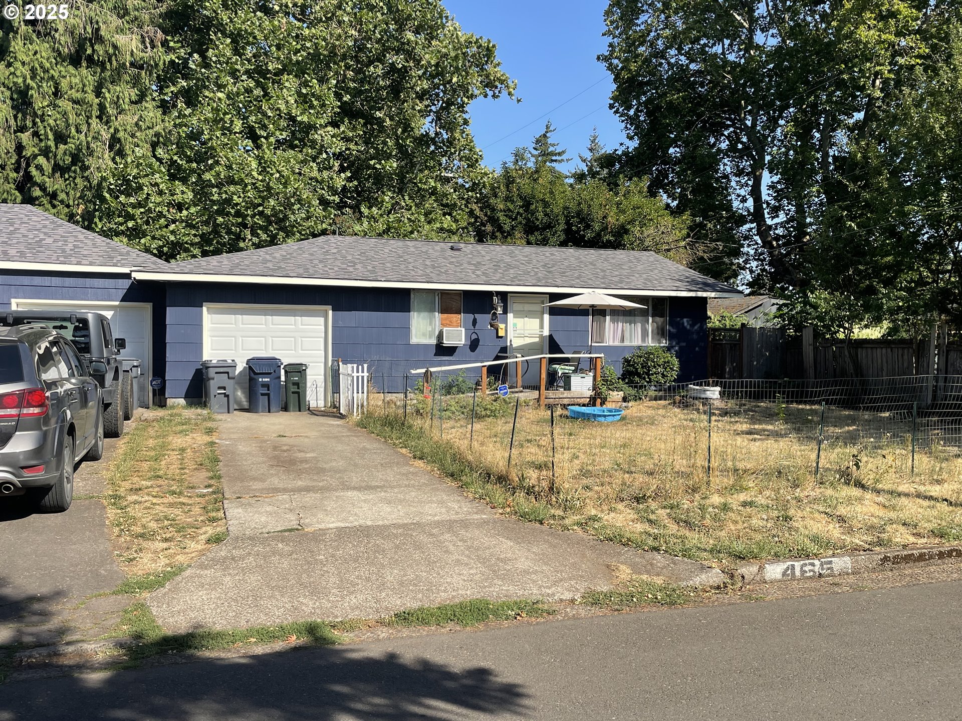 465 Davis Street Eugene, OR 97402 - Photo 3 of 11 a view of a house with large trees in the patio