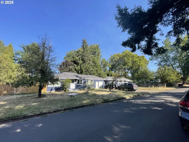 a view of a house with outdoor space and sitting area