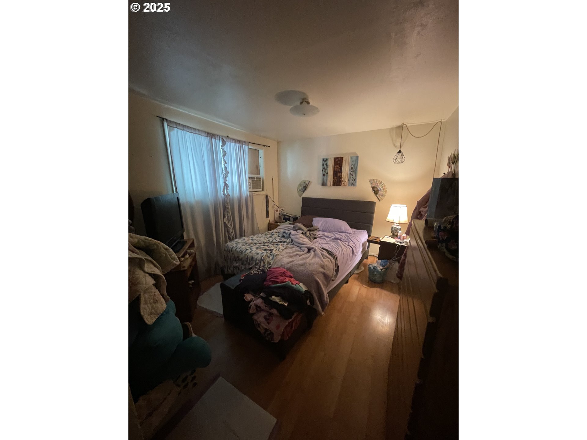 465 Davis Street Eugene, OR 97402 - Photo 9 of 11 a bedroom with a bed and a night stand