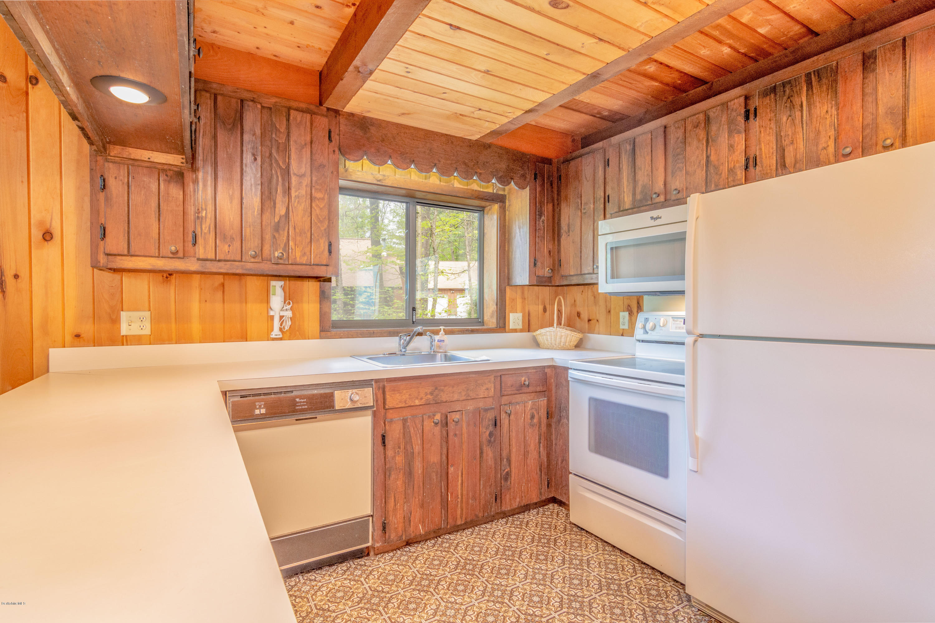 673 West Center Road Otis, MA 01253 - Photo 2 of 23 a kitchen with a sink cabinets and window