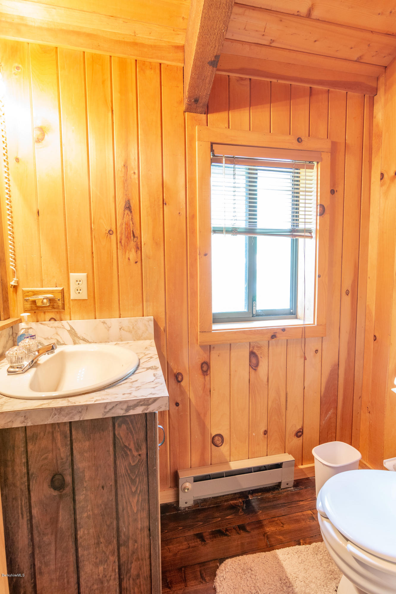 673 West Center Road Otis, MA 01253 - Photo 13 of 23 a bathroom with a sink a toilet and shower curtain