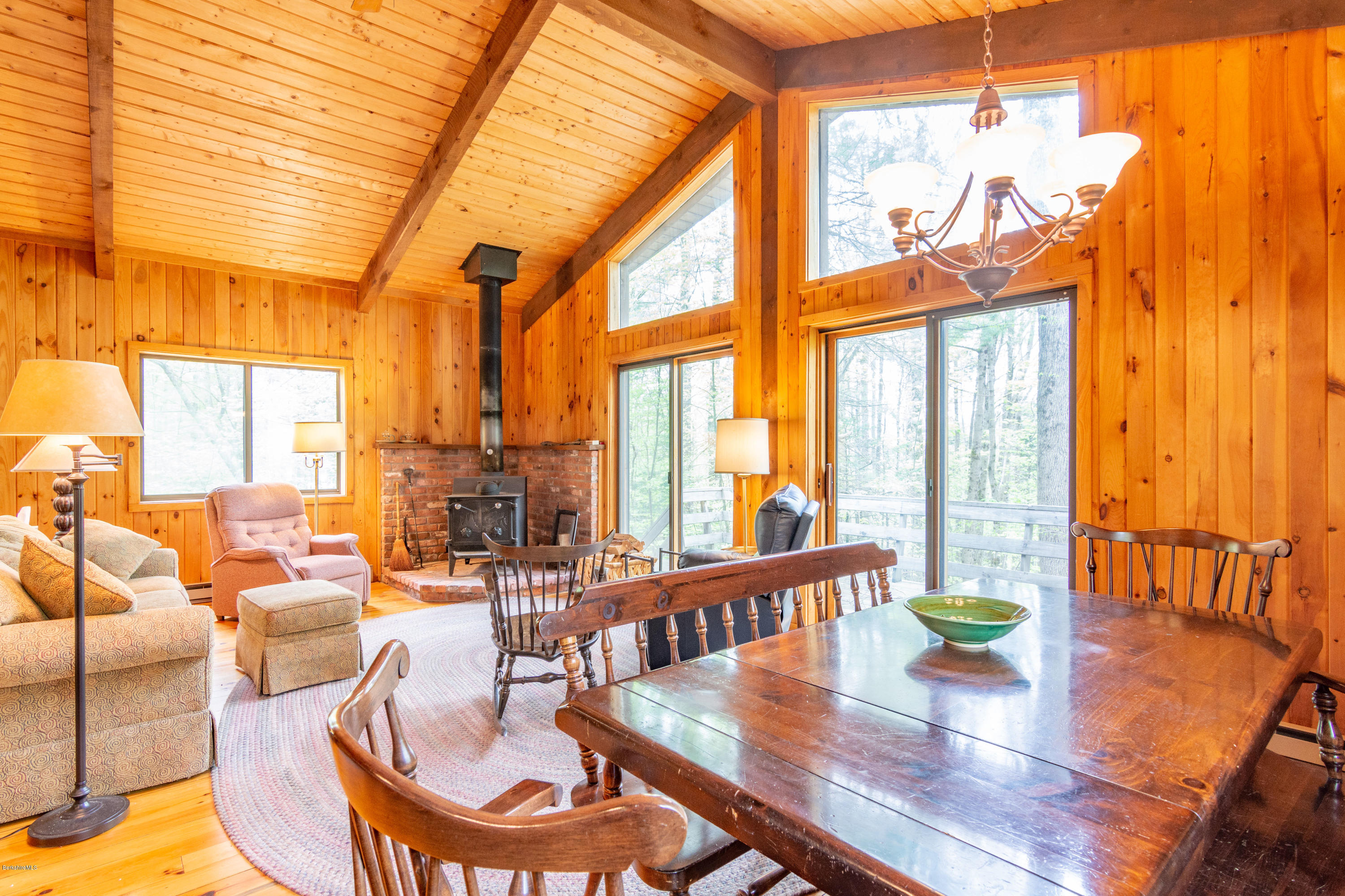 673 West Center Road Otis, MA 01253 - Photo 5 of 23 a living room with furniture a fireplace and a large window