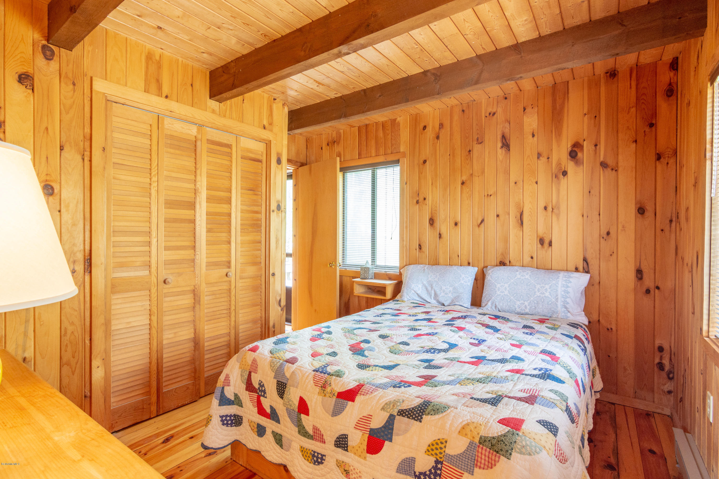 673 West Center Road Otis, MA 01253 - Photo 8 of 23 a bedroom with a bed and a window