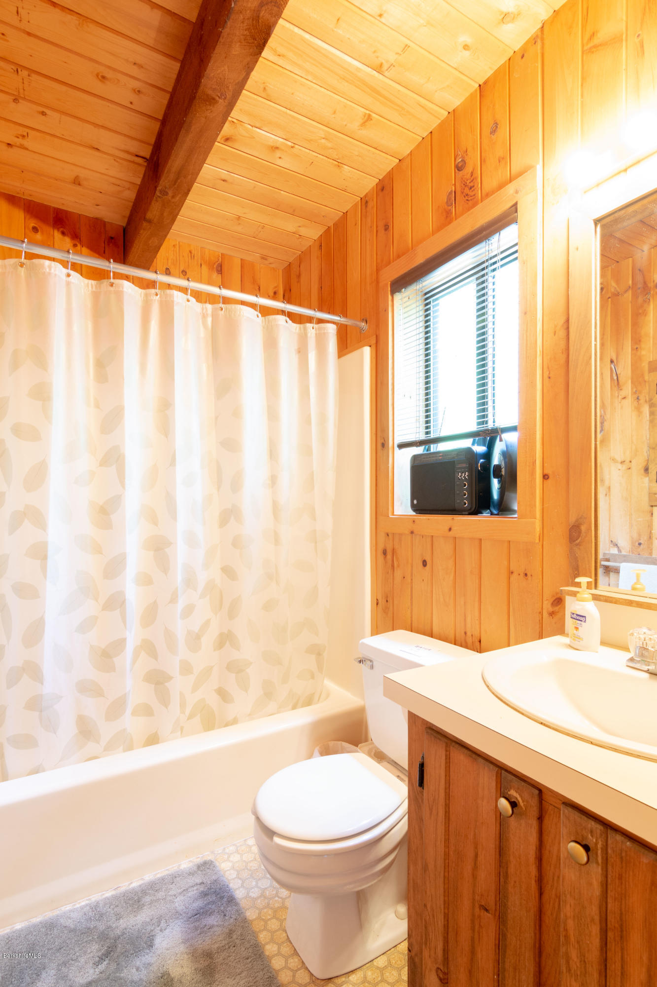 673 West Center Road Otis, MA 01253 - Photo 9 of 23 a bathroom with a granite countertop sink toilet and shower