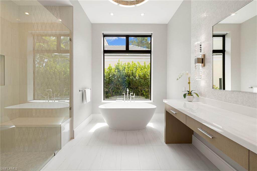 2345 Tarpon Road Naples, FL 34102 - Photo 23 of 43 Bathroom featuring a soaking tub, vanity, walk in shower, and recessed lighting