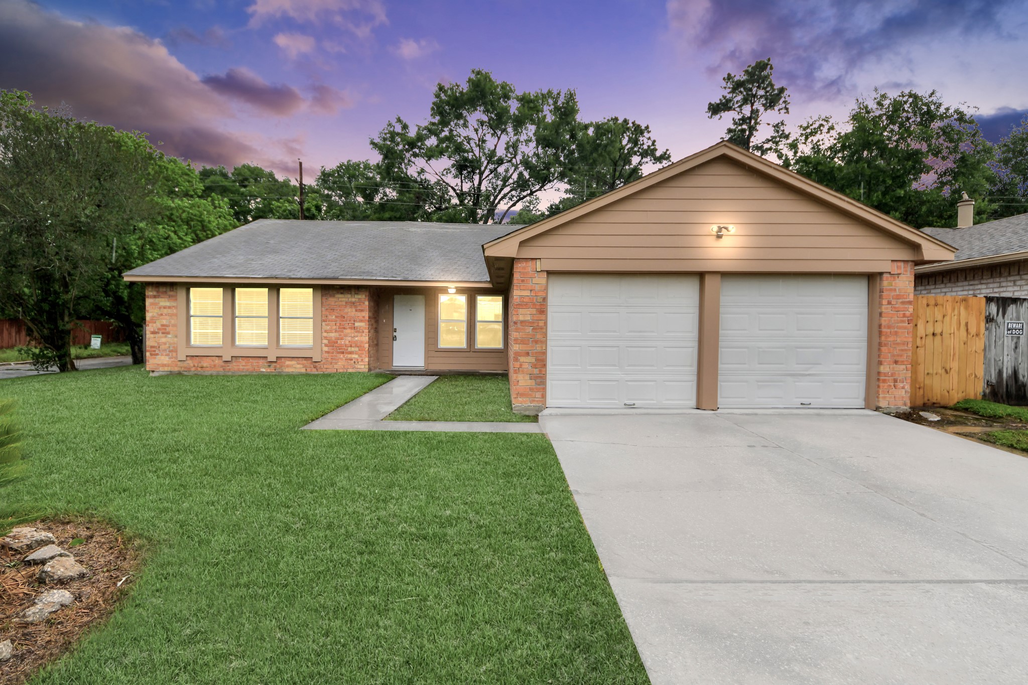 6603 Brookgate Drive Spring, TX 77373 - Photo 1 of 22 a front view of a house with a yard and garage