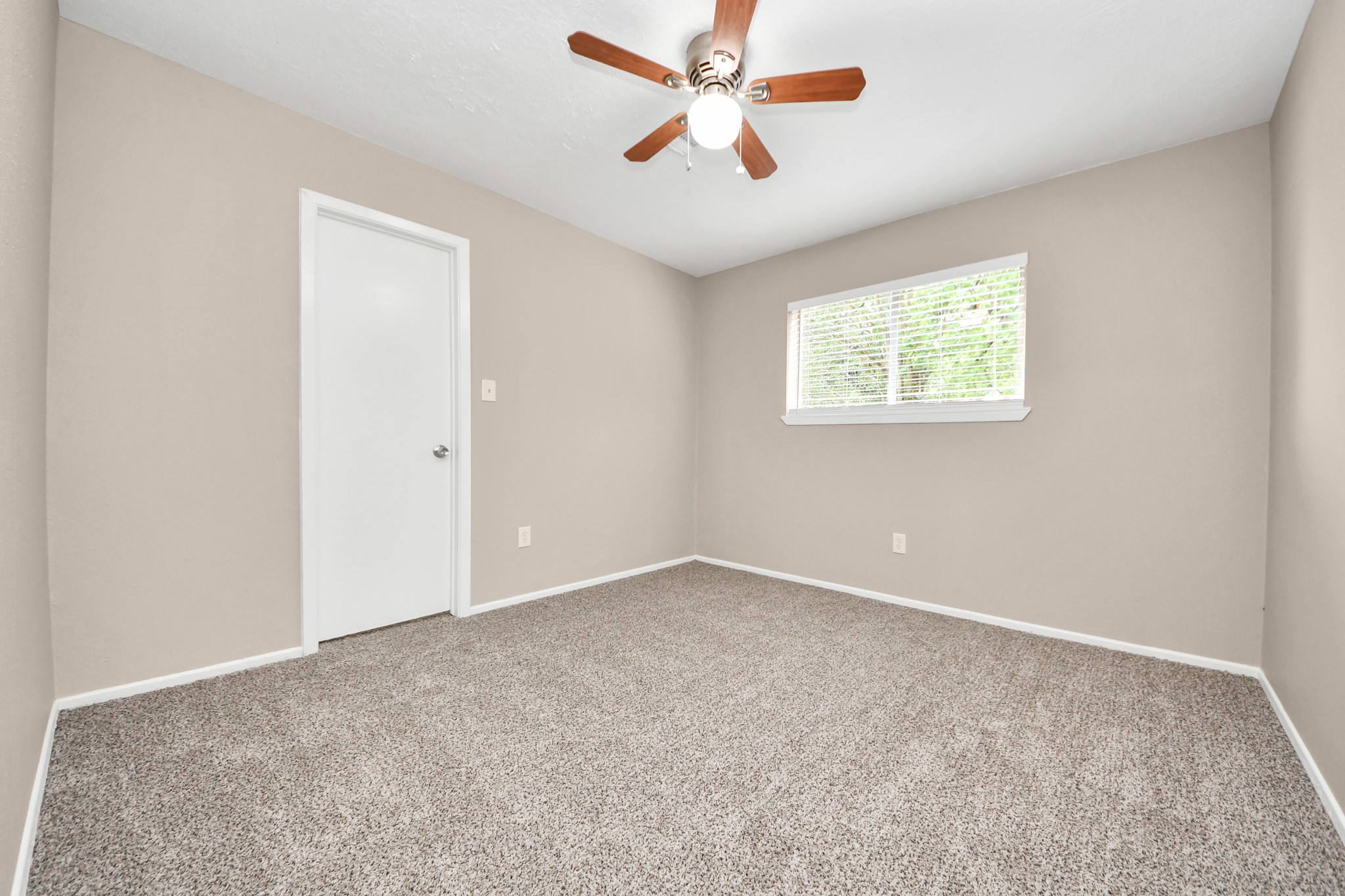 6603 Brookgate Drive Spring, TX 77373 - Photo 18 of 22 an empty room with windows and fan