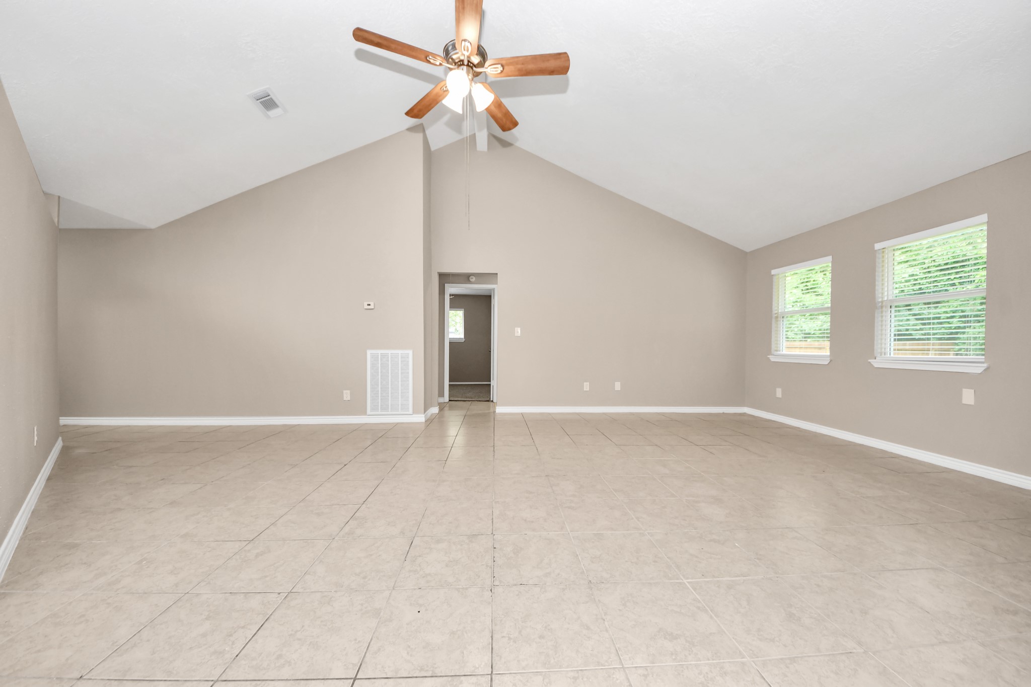 6603 Brookgate Drive Spring, TX 77373 - Photo 4 of 22 a view of an empty room with a window