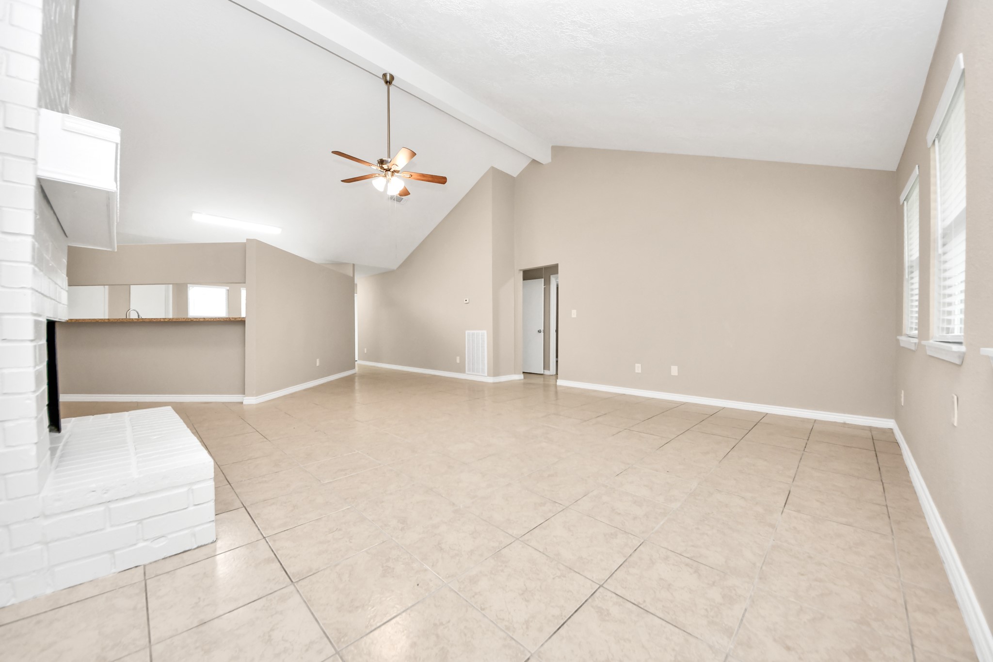 6603 Brookgate Drive Spring, TX 77373 - Photo 5 of 22 an empty room with windows and fan