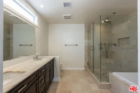 a view of wooden floor and windows in a room