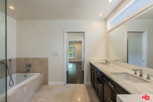 a bathroom with a sink and shower