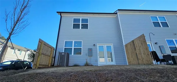 a view of a house with a backyard