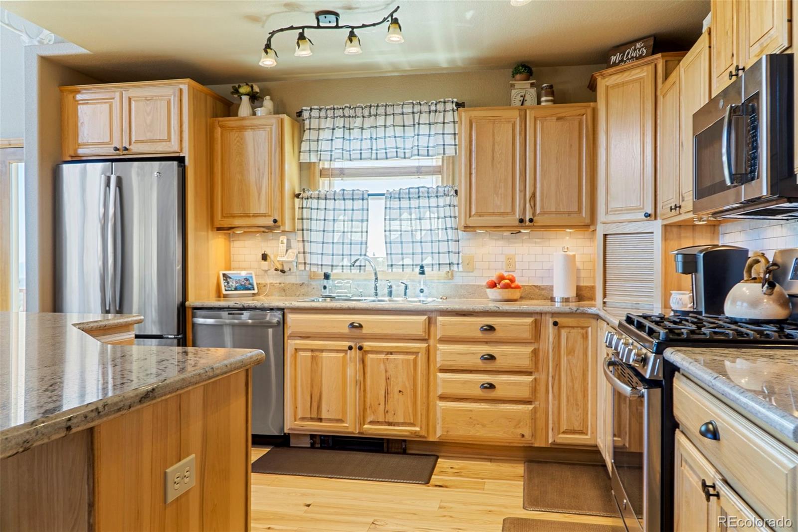 378 Silver Heels Circle Fairplay, CO 80440 - Photo 12 of 40 a kitchen with stainless steel appliances granite countertop a stove a sink dishwasher and a refrigerator