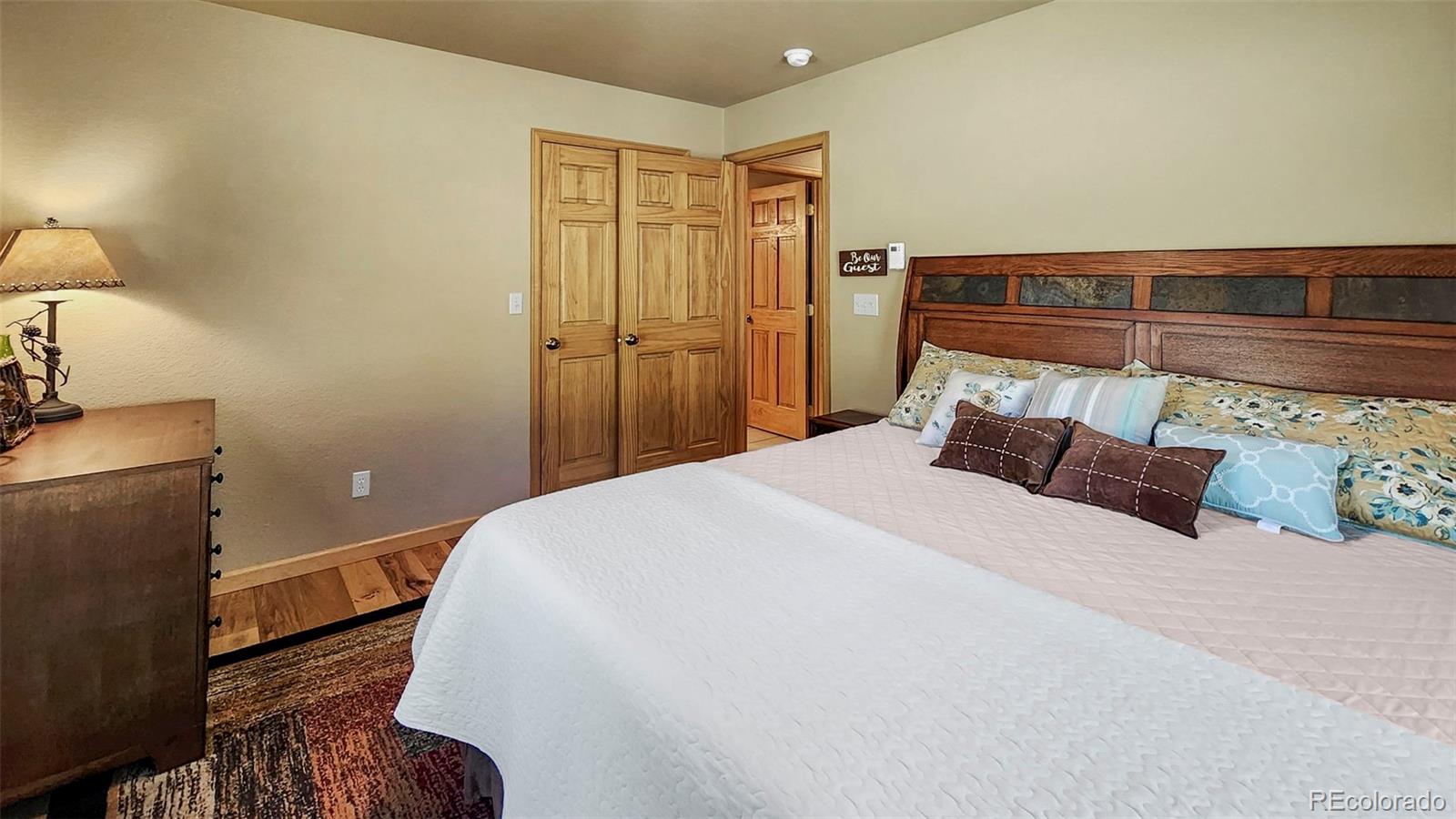 378 Silver Heels Circle Fairplay, CO 80440 - Photo 14 of 40 a bedroom with a bed and a lamp