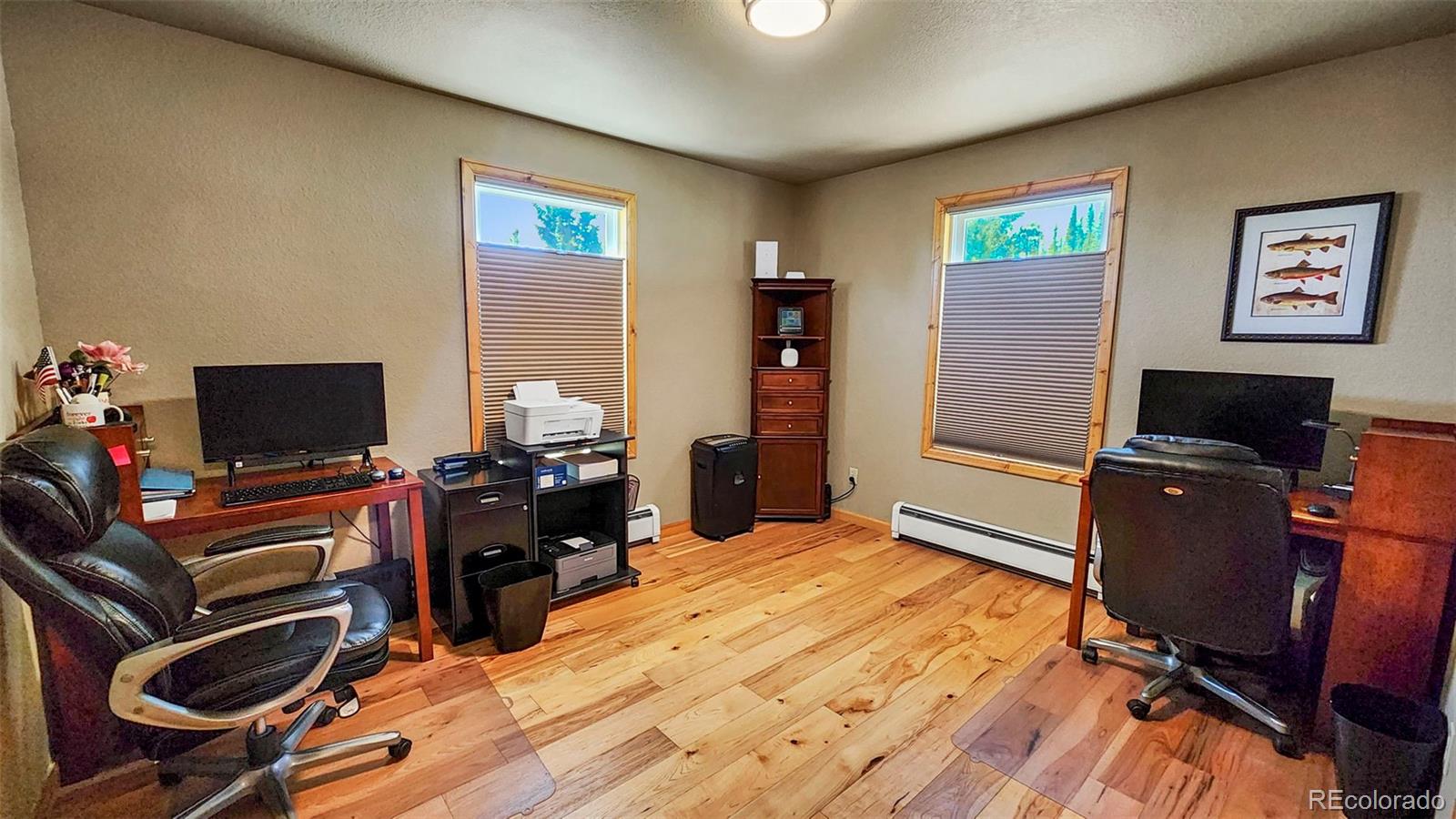 378 Silver Heels Circle Fairplay, CO 80440 - Photo 17 of 40 a bedroom with furniture and a desk