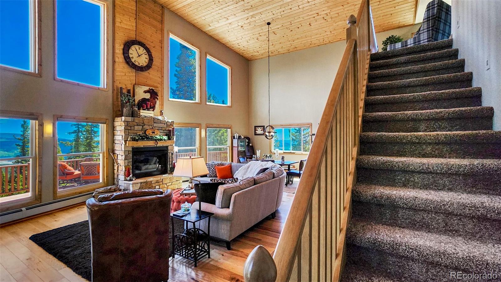 378 Silver Heels Circle Fairplay, CO 80440 - Photo 27 of 40 a view of a living room with furniture and a fireplace