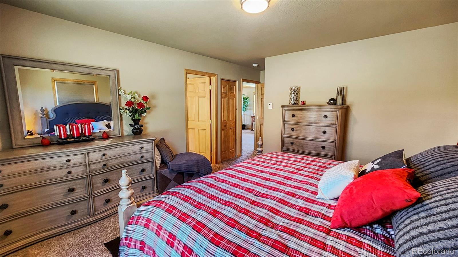 378 Silver Heels Circle Fairplay, CO 80440 - Photo 35 of 40 a bedroom with a bed and a flat screen tv