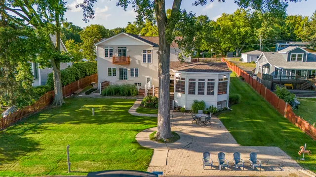 a living room with furniture a rug and a chandelier