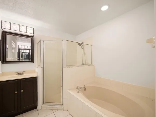 a bathroom with a bathtub and a sink