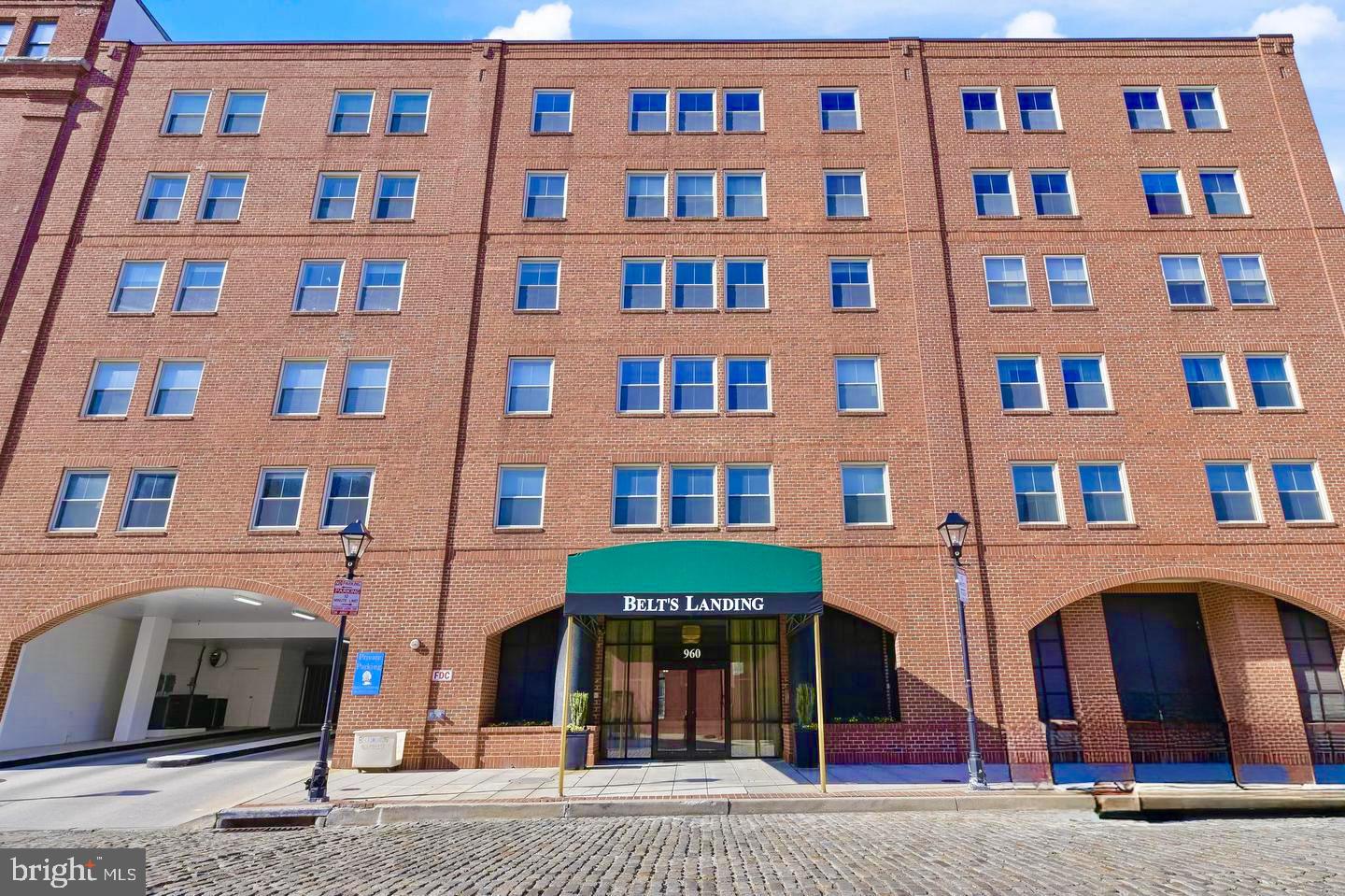 960 Fell Street, Unit 609 Baltimore, MD 21231 - Photo 11 of 45 a front view of a building with many windows