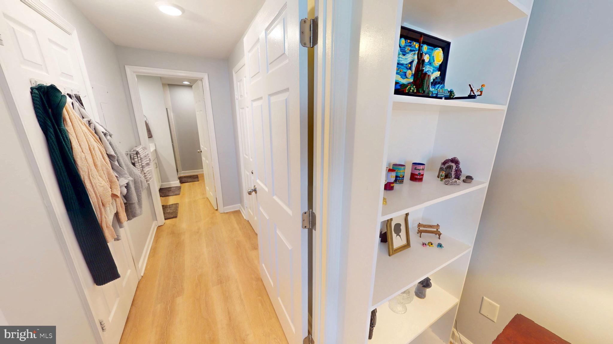 960 Fell Street, Unit 609 Baltimore, MD 21231 - Photo 23 of 45 a view of a hallway with wooden floor and entryway