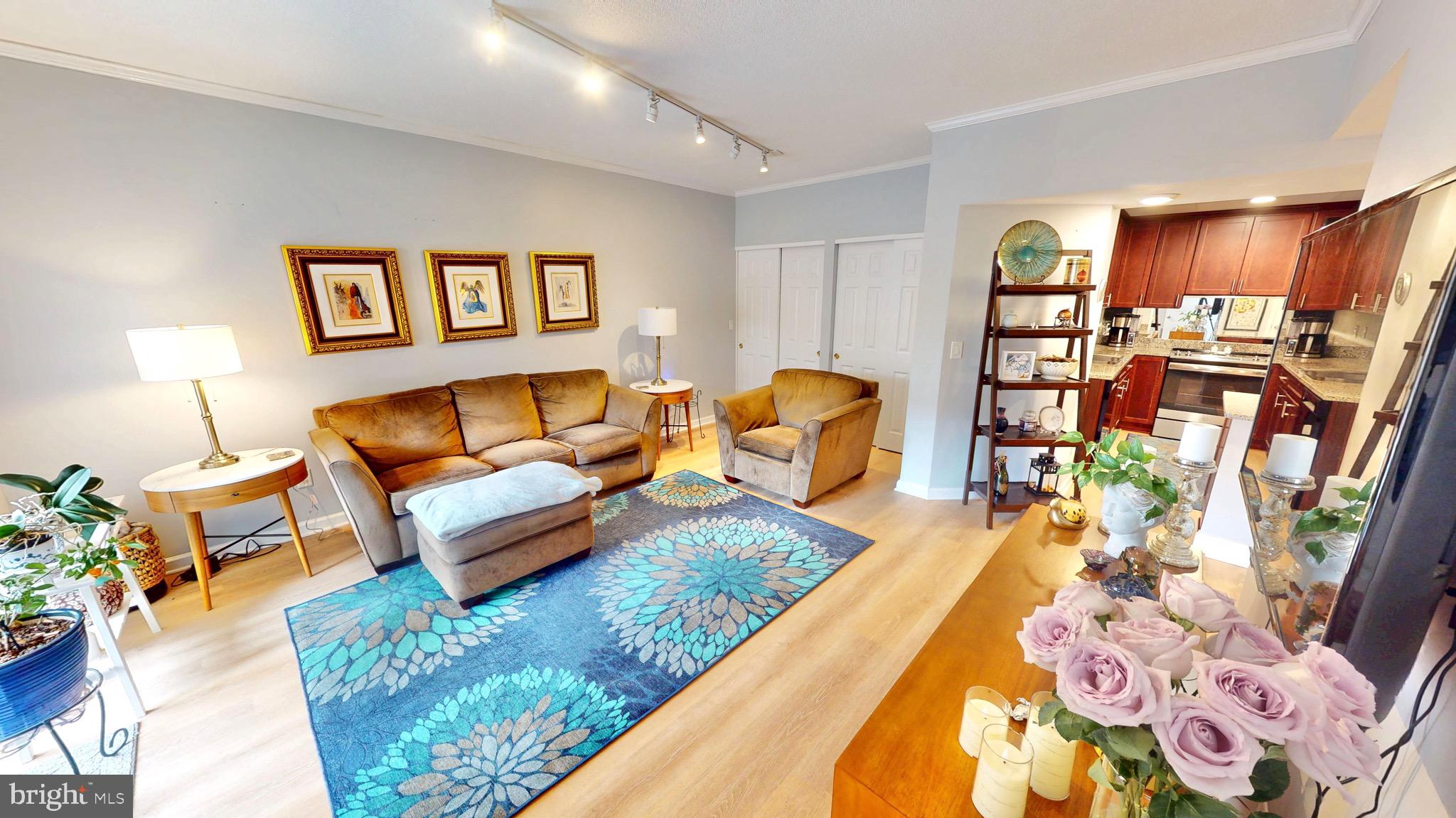 960 Fell Street, Unit 609 Baltimore, MD 21231 - Photo 4 of 45 a living room with furniture and a wooden floor