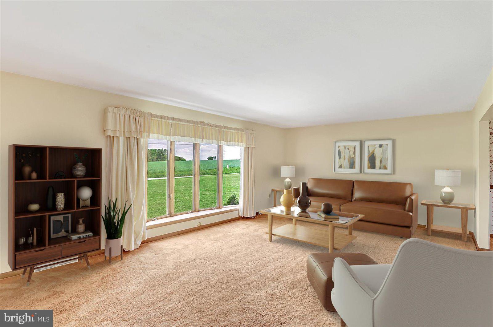 7112 Church Road Felton, PA 17322 - Photo 8 of 34 a living room with furniture and large window