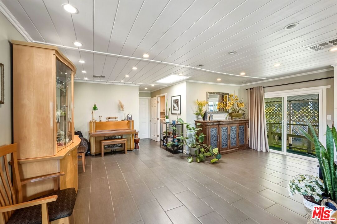 29500 Heathercliff Road, Unit 87 Malibu, CA 90265 - Photo 13 of 58 a view of a room with furniture a potted plant and wooden floor