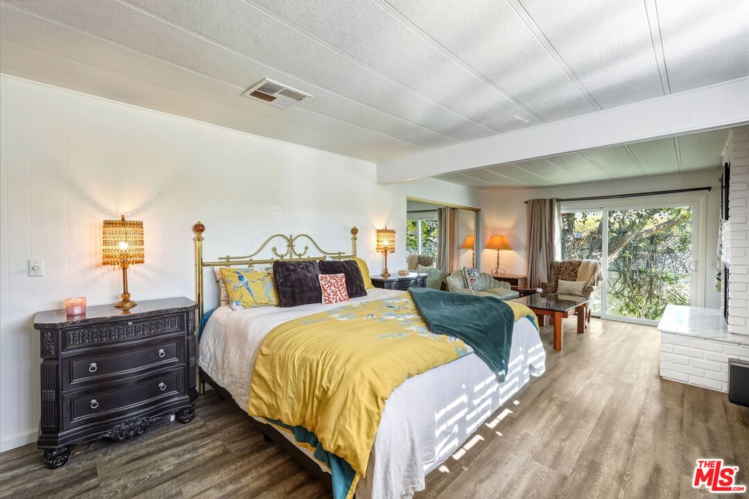 29500 Heathercliff Road, Unit 87 Malibu, CA 90265 - Photo 14 of 58 a bed room with a bed and a couch