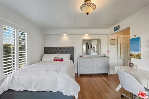 a bathroom with a toilet sink and shower