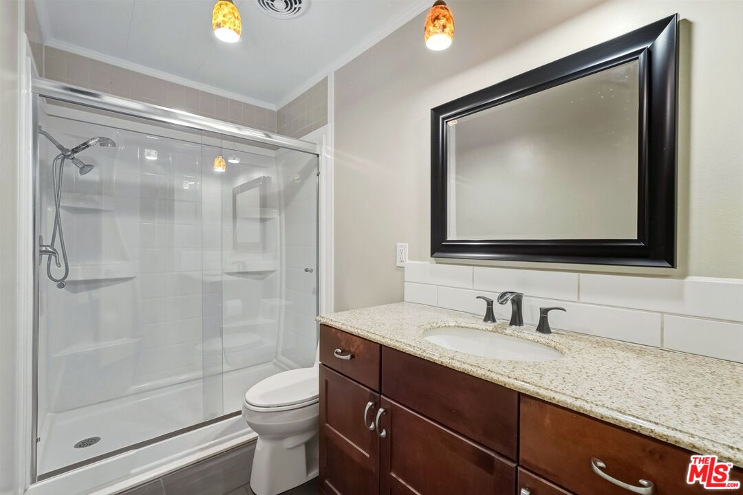 29500 Heathercliff Road, Unit 87 Malibu, CA 90265 - Photo 23 of 58 a bathroom with a toilet sink and shower
