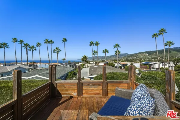 a view of a terrace with furniture