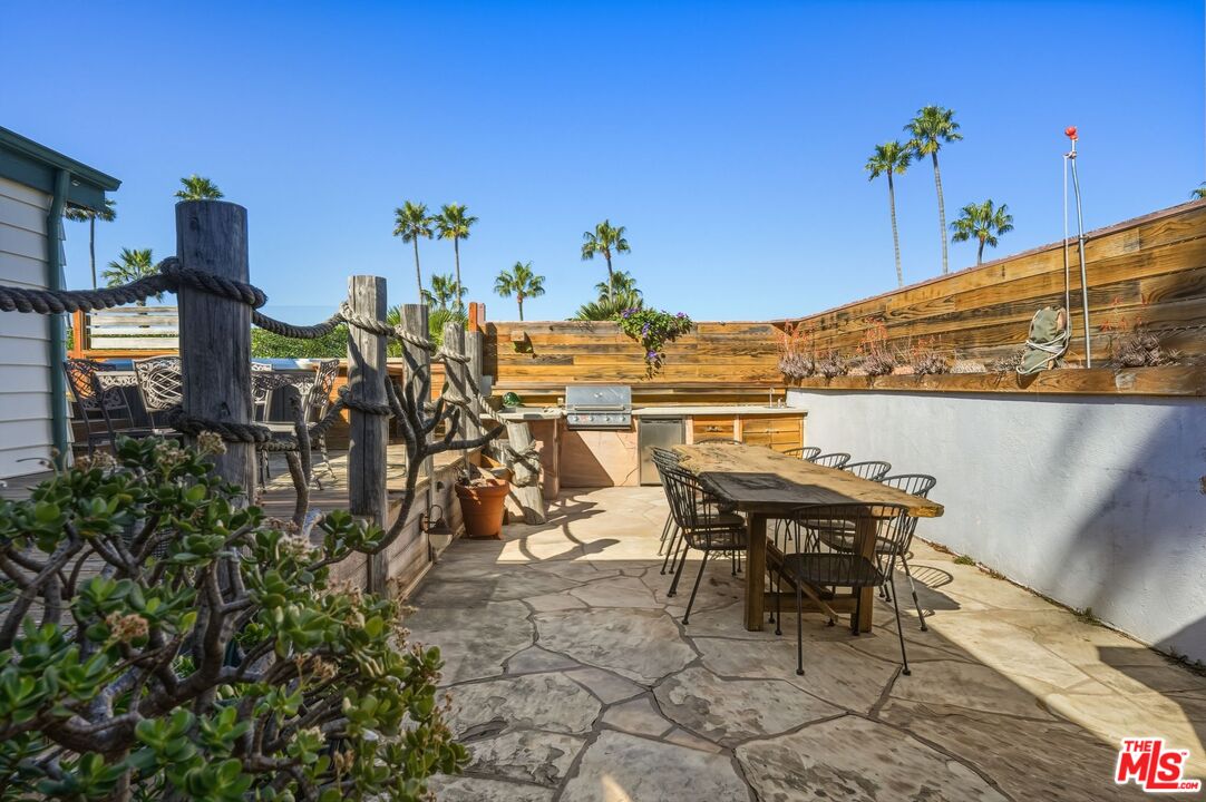 29500 Heathercliff Road, Unit 87 Malibu, CA 90265 - Photo 35 of 58 a view of a terrace with furniture