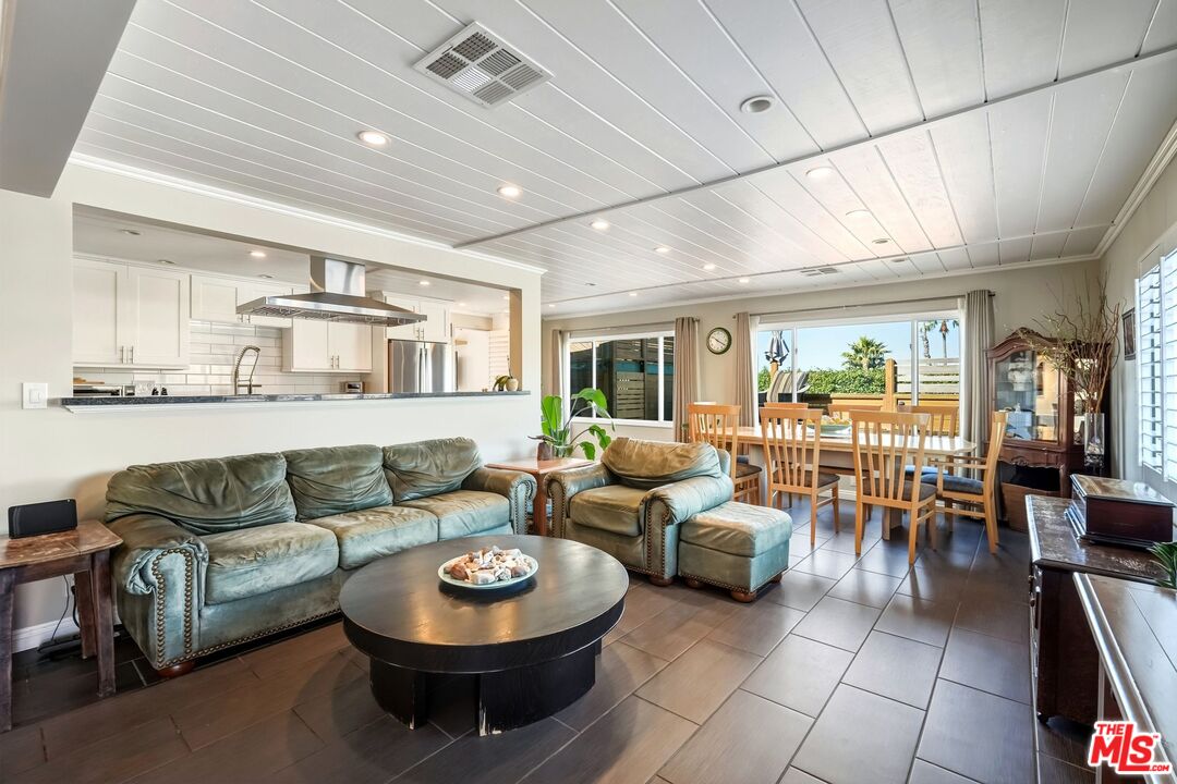 29500 Heathercliff Road, Unit 87 Malibu, CA 90265 - Photo 4 of 58 a living room with furniture and a large window