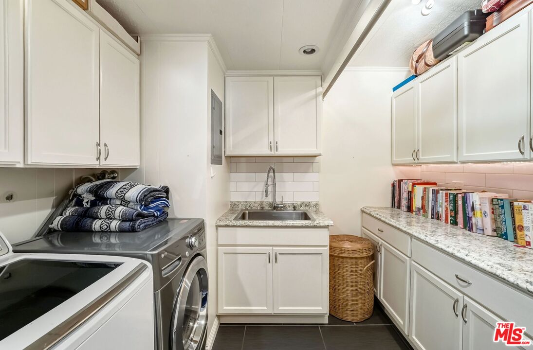 29500 Heathercliff Road, Unit 87 Malibu, CA 90265 - Photo 41 of 58 a kitchen with stainless steel appliances granite countertop a sink stove and cabinets