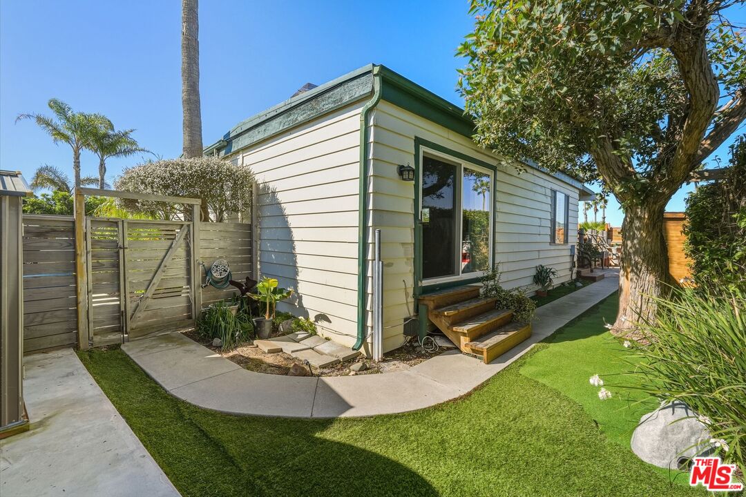 29500 Heathercliff Road, Unit 87 Malibu, CA 90265 - Photo 44 of 58 a front view of a house with garden