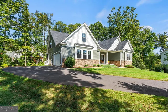 an aerial view of a house with a big yard