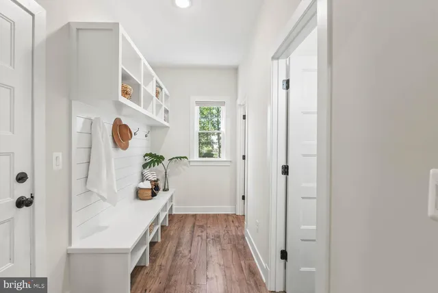 a living room with furniture and a book shelf